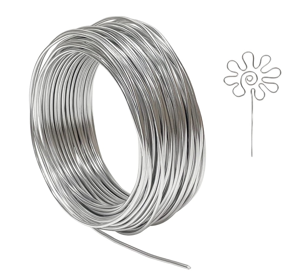 A coil of shiny silver wire with a small section bent into a decorative flower shape—perfect for beaded garden stakes DIY—displayed beside it on a white background.